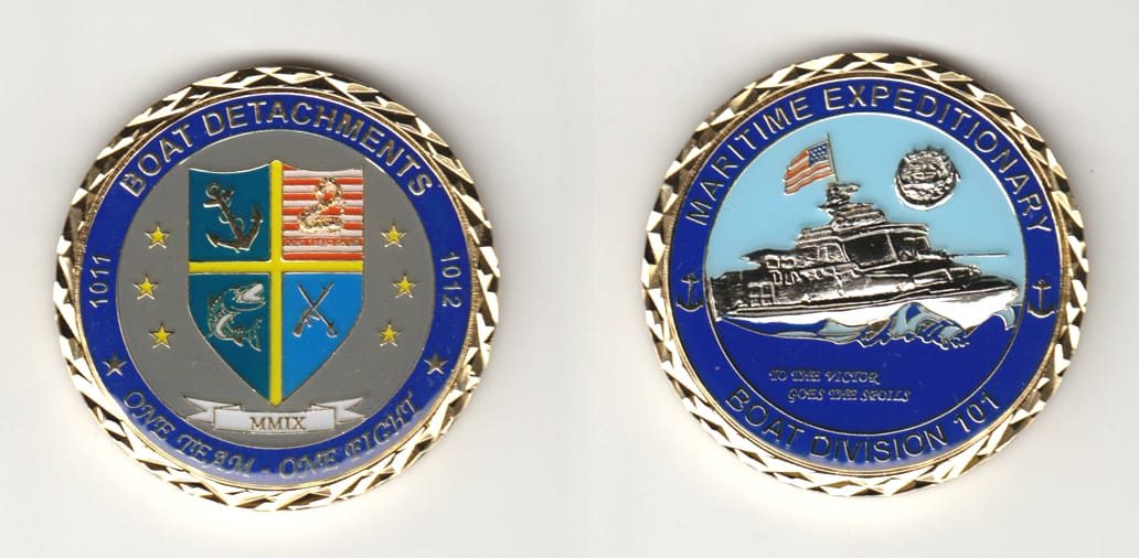 Round shaped, gold colored coin 2 inches in diameter.