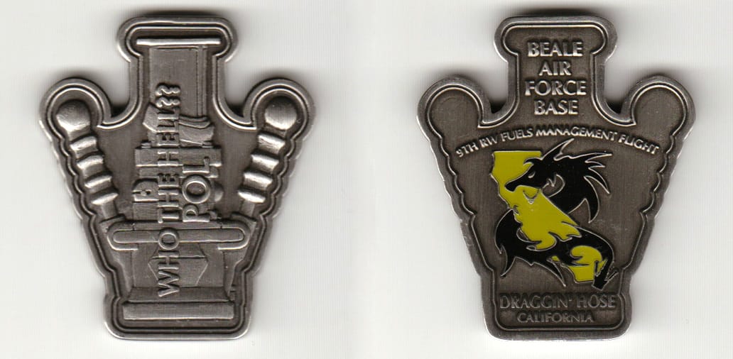 POL pump shaped, pewter colored coin 1-5/8 inches wide x 2 inches high.