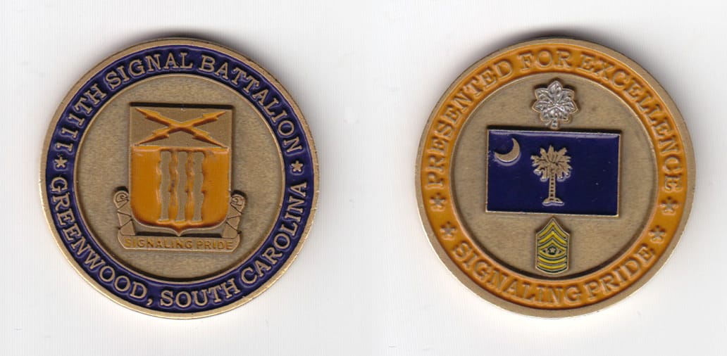 Round shaped, antique brass colored coin 1-5/8 inches in diameter.