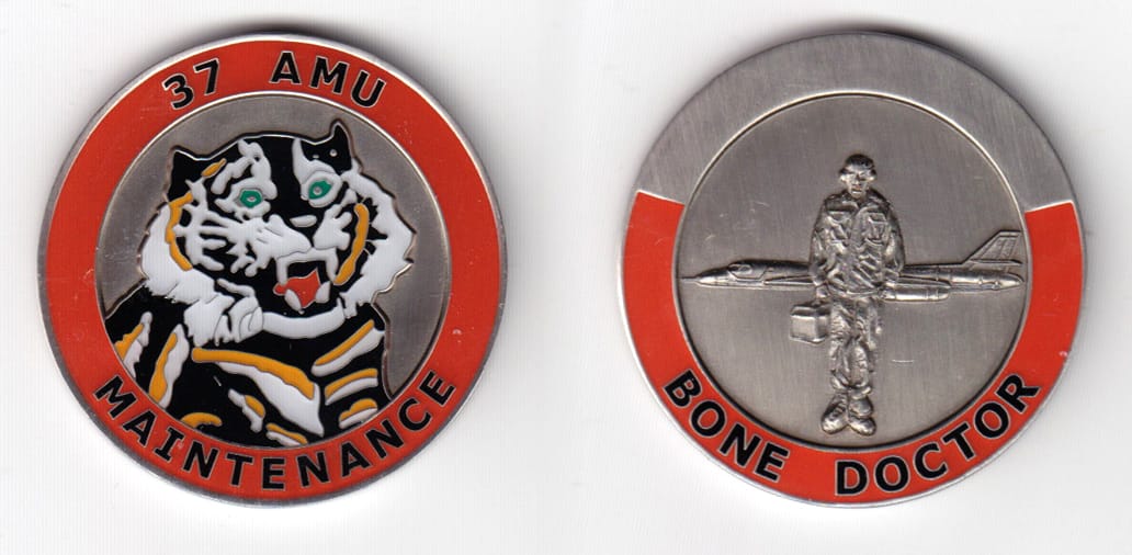 Round shaped, pewter colored coin 1-3/4 inches in diameter.