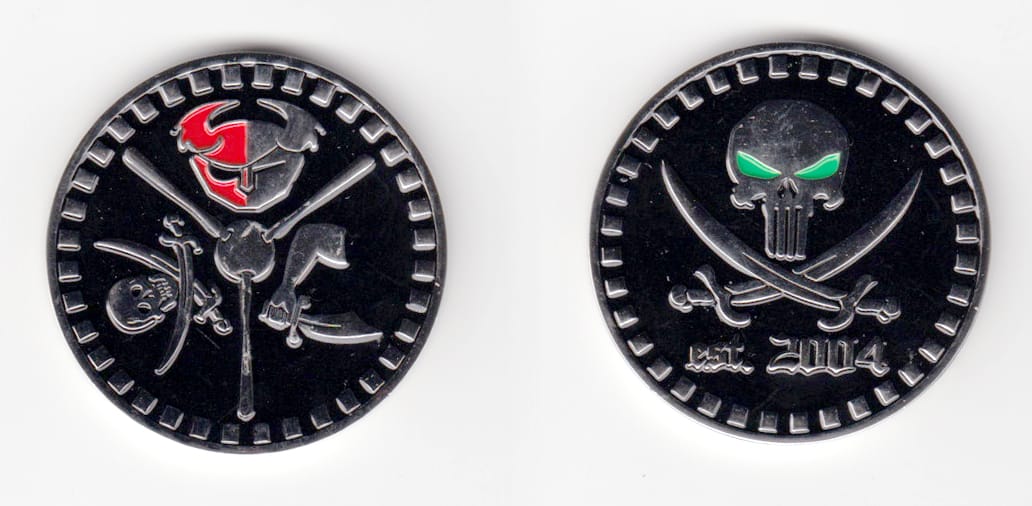 Round shaped, silver colored coin 1-3/4 inches in diameter.