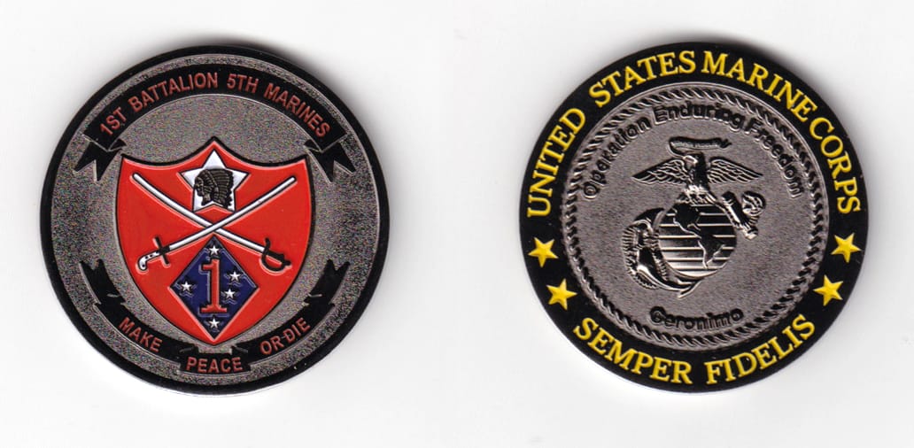 Round shaped, gun metal black colored coin 1-7/8 inches in diameter.