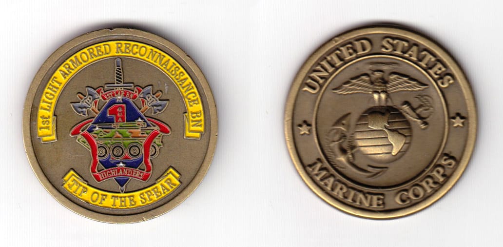 Round shaped, brass colored coin 1-3/4 inches in diameter.