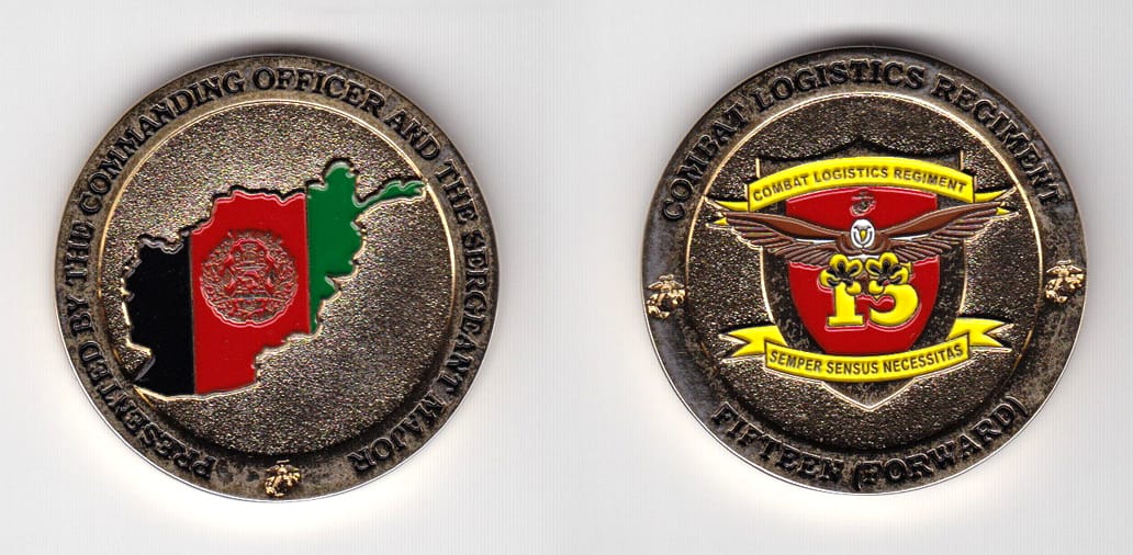 Round shaped, gold colored coin 1-3/4 inches in diameter.