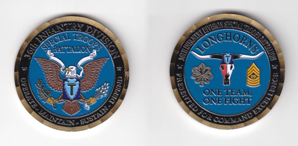 Round shaped, gold colored coin 2 inches in diameter.