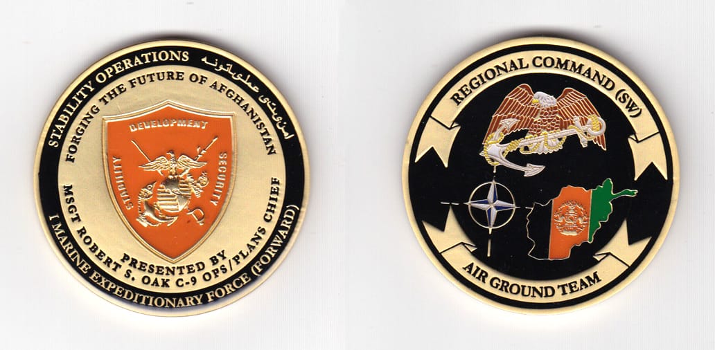 Round shaped, brass colored coin 2 inches in diameter.