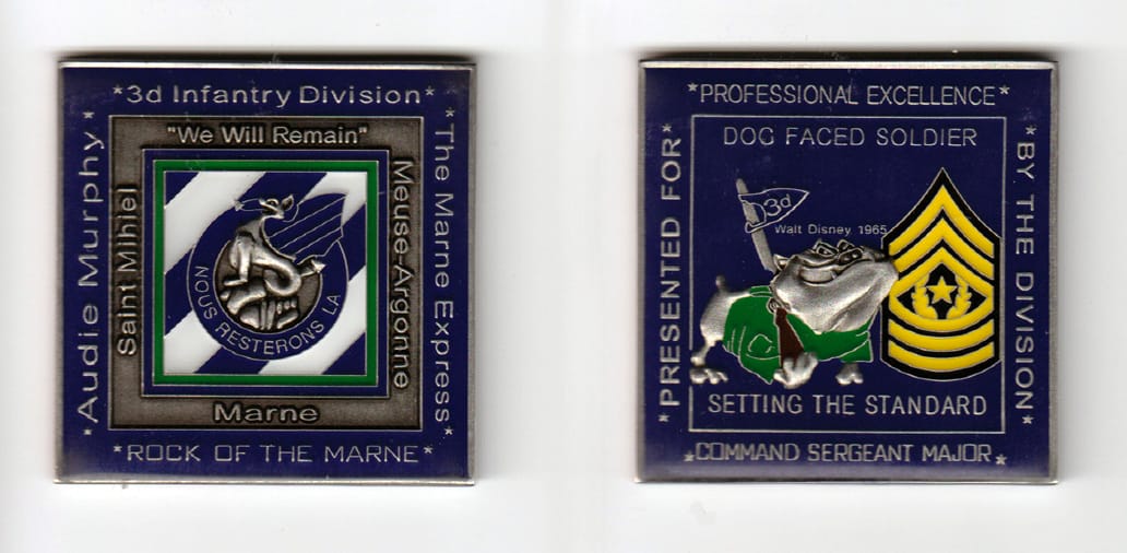 Square shaped, brass colored coin 2 inches wide x 2 inches high.