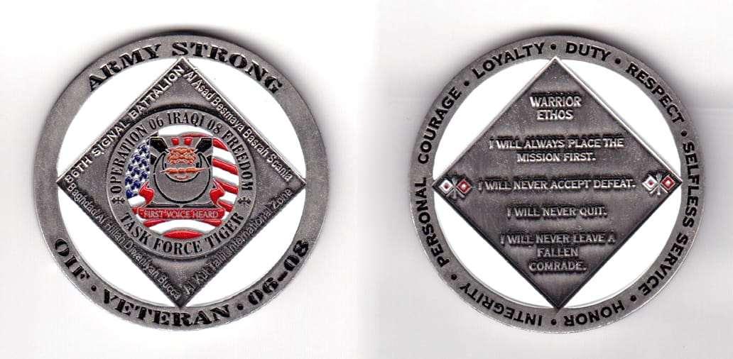 Round shaped,  pewter colored coin 2 inches in diameter.