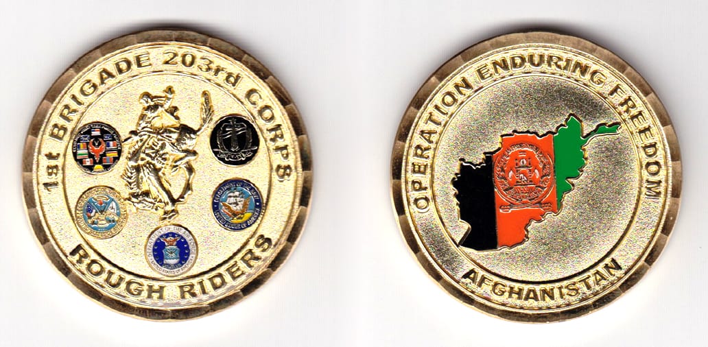 Round shaped,  gold colored coin 2 inches in diameter.