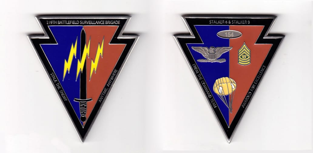 Arrow shaped, pewter colored coin, 2-3/4 inches wide x 3 inches high.