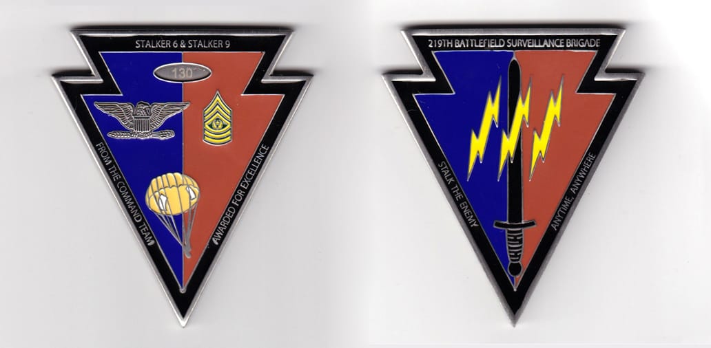 Arrow shaped, pewter colored coin, 2-3/4 inches wide x 3 inches high.