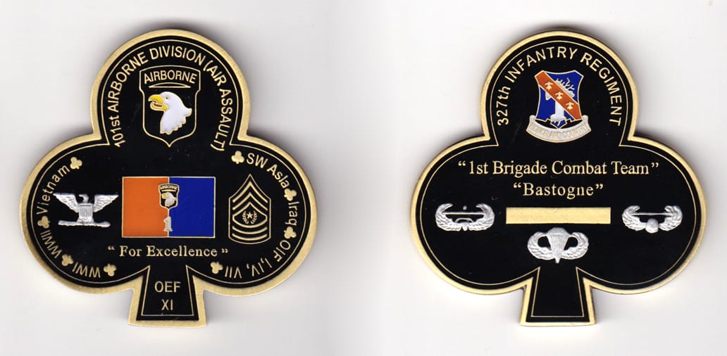 Clover shaped, brass colored coin, 2-3/8 inches wide x 2-1/4 inches high.