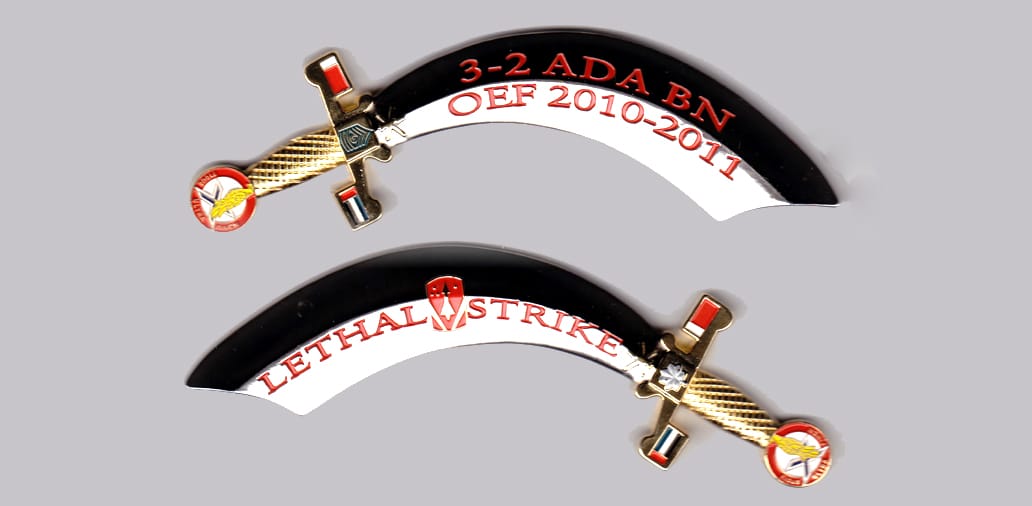 Arab saber shaped  silver colored coin, 5 inches wide x 1-1/2 inches high.