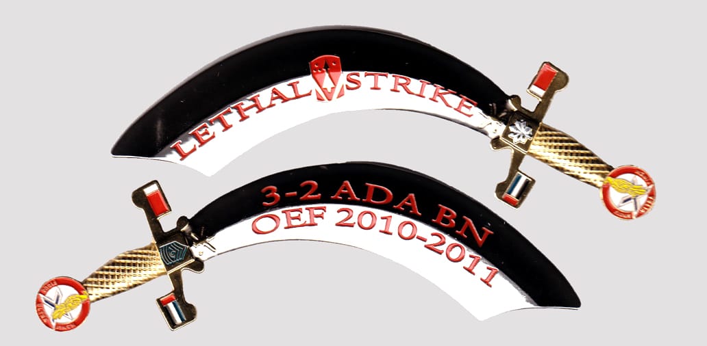 Arab saber shaped  silver colored coin, 5 inches wide x 1-1/2 inches high.