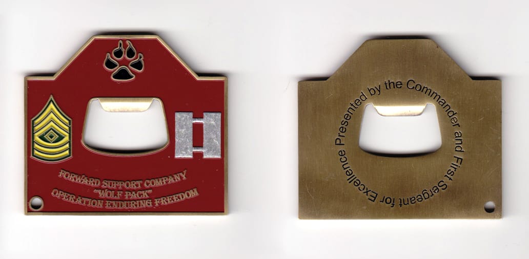 Retangular shaped with half triangle mounted above, bottle opener cut from interior, brass colored coin, 2-1/2 inches wi...