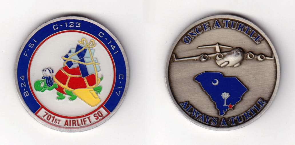 Round shaped, silver colored coin, 1-1/2 inches in diameter.