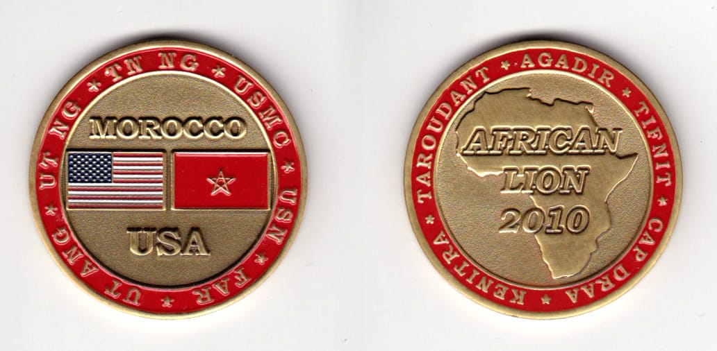 Round shaped, brass colored coin, 1-1/2 inches in diameter.