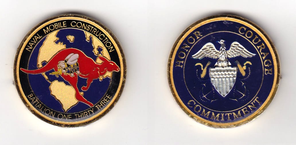 Round shaped, gold colored coin, 1-1/2 inches in diameter.