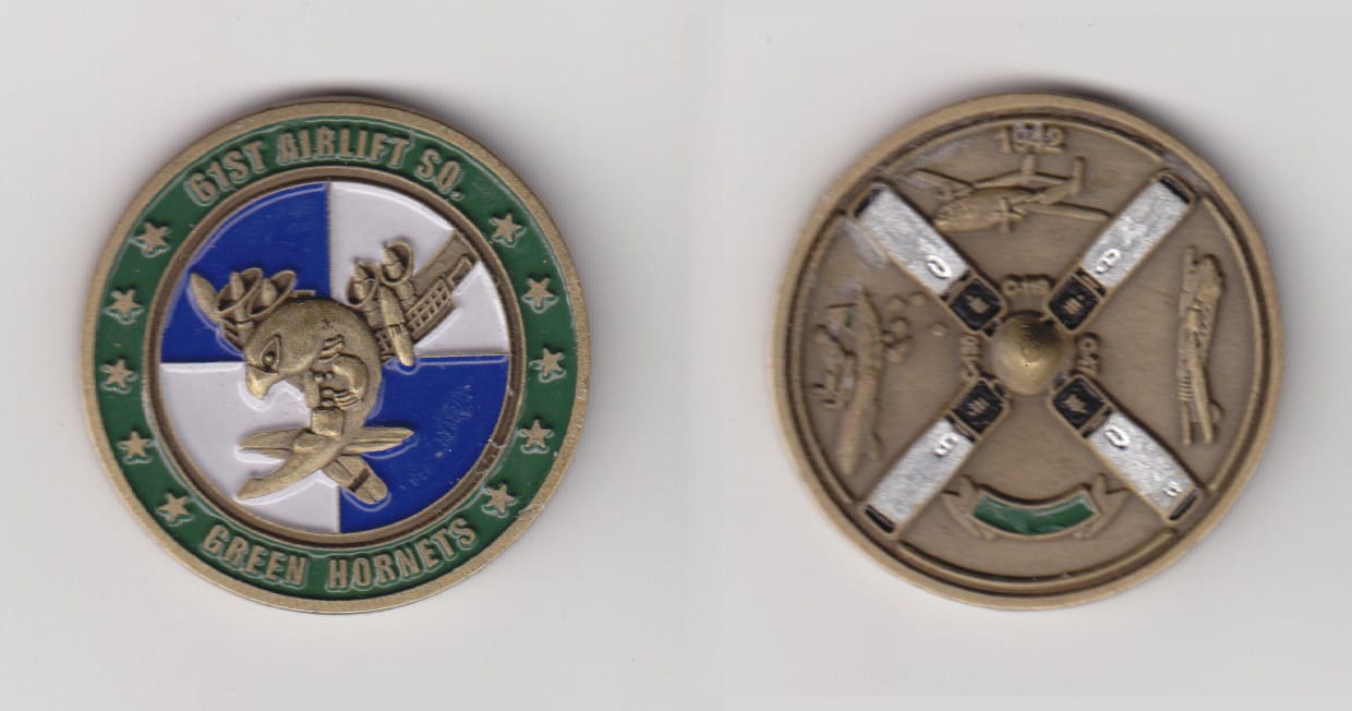 Round shaped, brass colored coin, 1-1/2 inches in diameter.