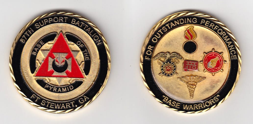 Round shaped, gold colored coin, 2 inches in diameter.