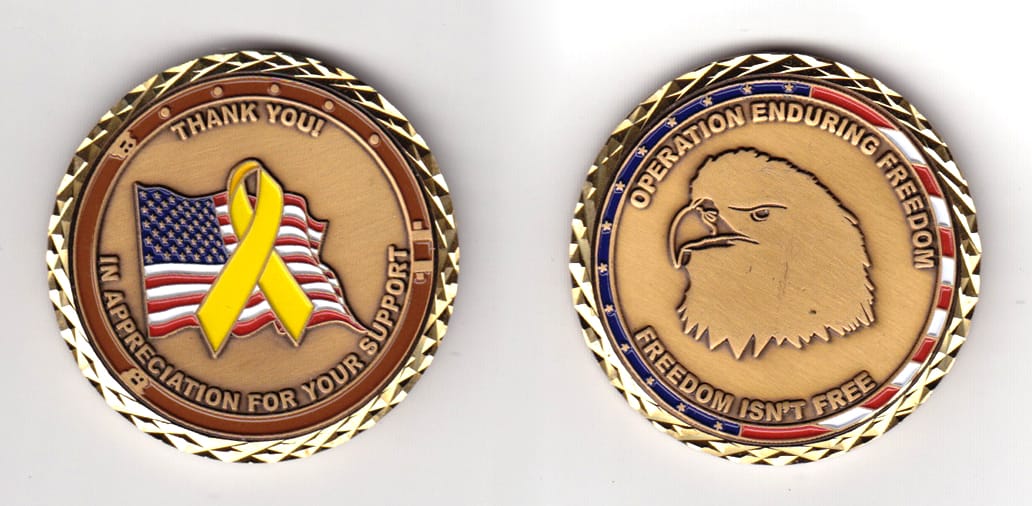 Round shaped, brass colored coin, 2 inches in diameter.