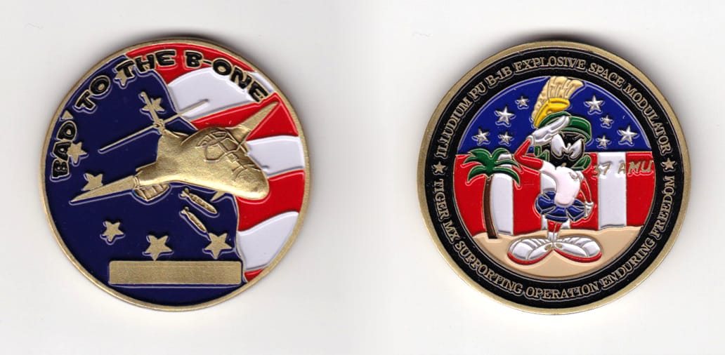 Round shaped, brass colored coin, 2 inches in diameter.