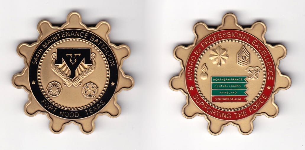 Round, sprocket shaped, brass colored coin, 2 inches in diameter.