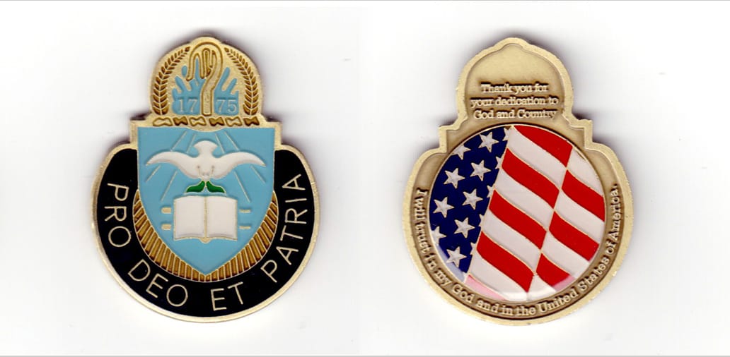 Round shaped, with top of shield and arch protruding above, brass colored coin, 1-3/4 inches wide x 2-1/4 inches high.