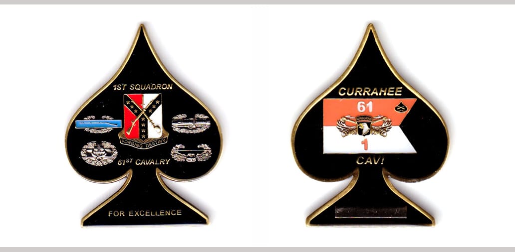 Ace of Spades shaped, brass colored coin, 1-3/4 inches wide x 2-1/4 inches high.