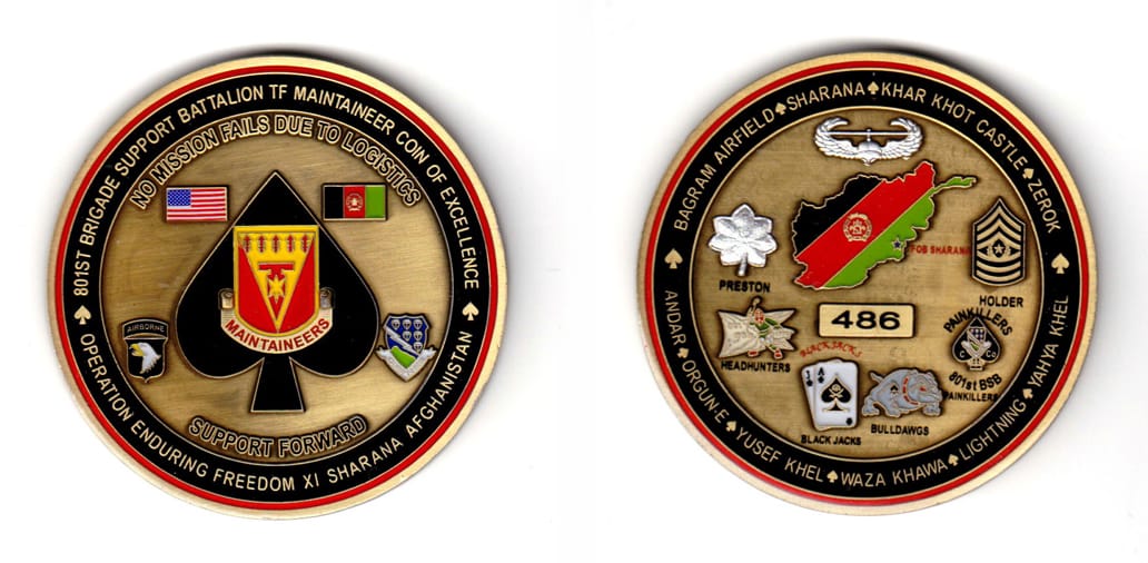 Round shaped, brass colored coin, 2-1/2 inches in diameter.