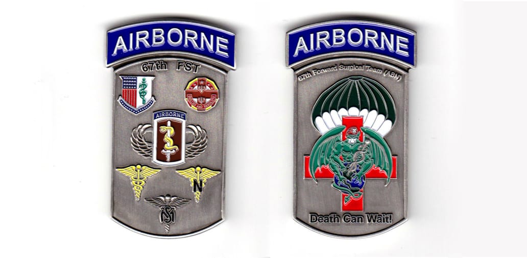 Dogtag shaped with Airborne tab mounted above, pewter colored coin, 1-5/8 inches wide x 2-5/8 inches high.