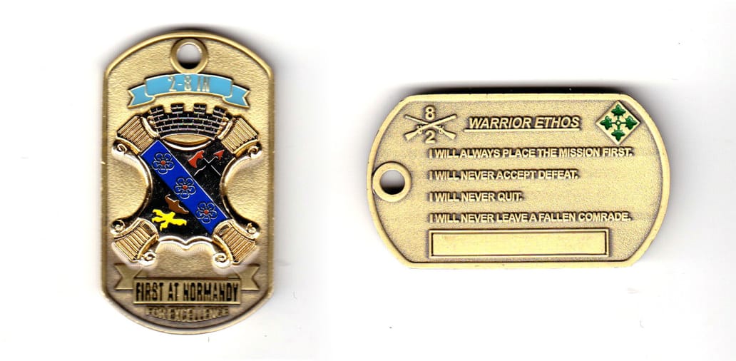 Dogtag shaped, brass colored coin, 1-3/8 inches wide x 2-1/4 inches high.