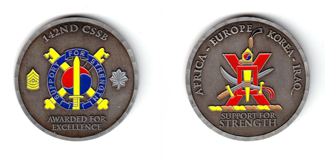 Round shaped, pewter colored coin, 2 inches in diameter.