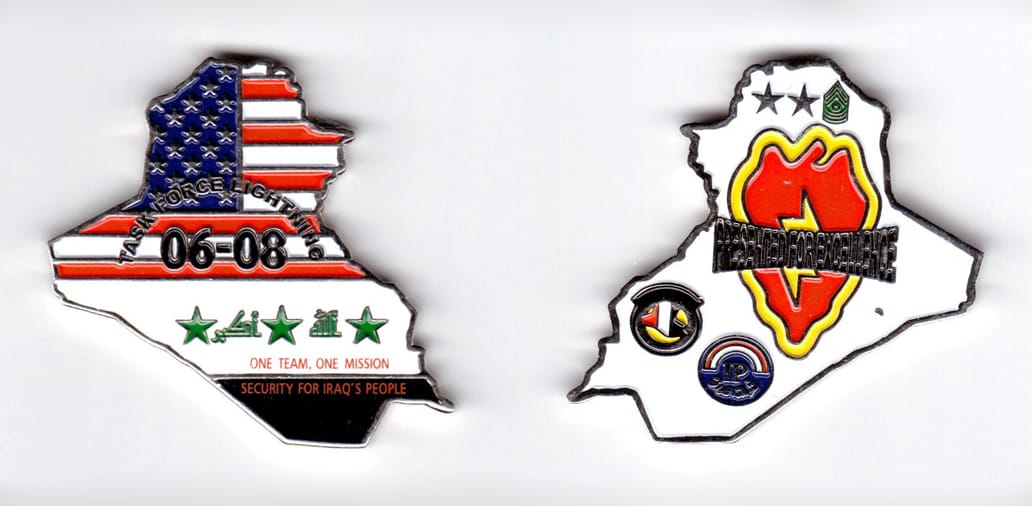 Iraq shaped, silver colored coin, 2 inches wide x 2 inches high.