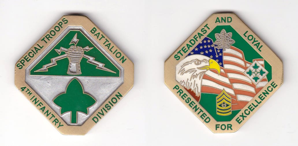 Diamond shaped with cropped points, brass colored coin, 2 inches wide x 2 inches high.