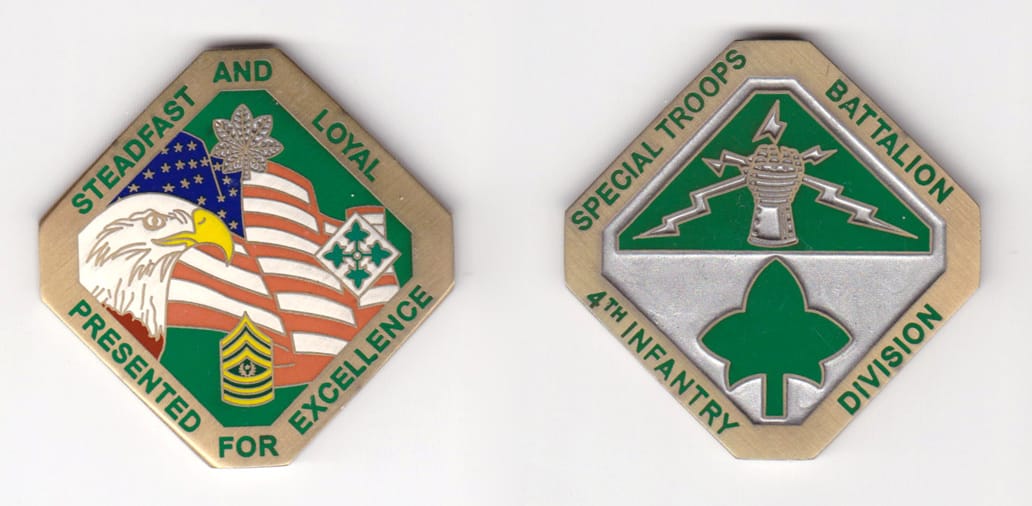 Diamond shaped with cropped points, brass colored coin, 2 inches wide x 2 inches high.