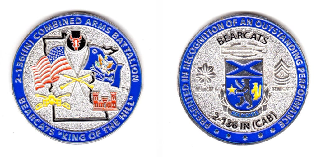 Round shaped, silver colored coin, 2 inches in diameter.