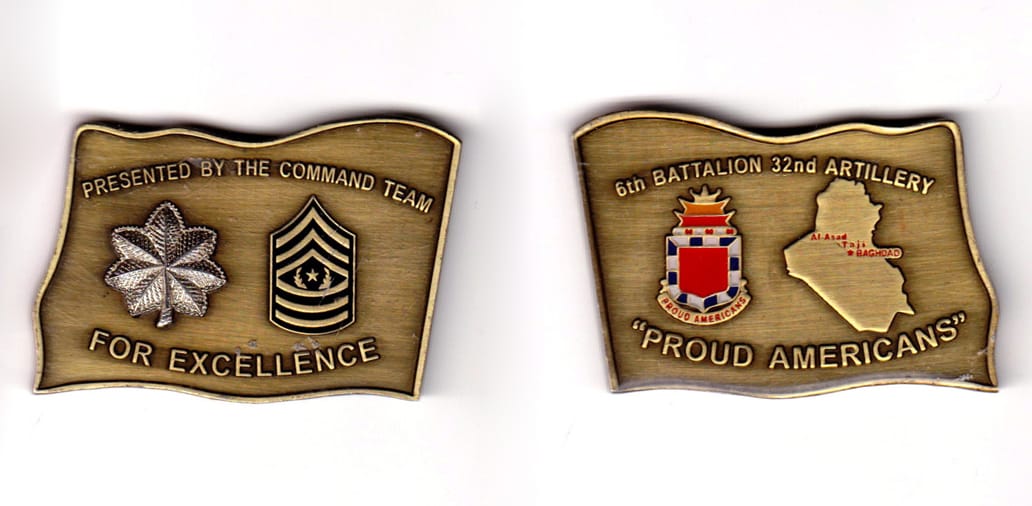 Flag shaped, brass colored coin, 2-1/8 inches wide x 1-1/2 inches high.