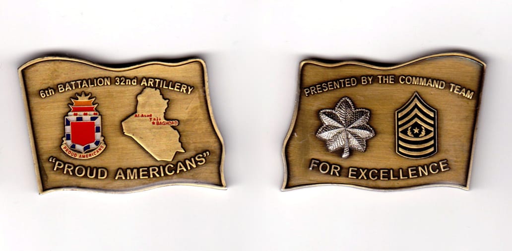 Flag shaped, brass colored coin, 2-1/8 inches wide x 1-1/2 inches high.