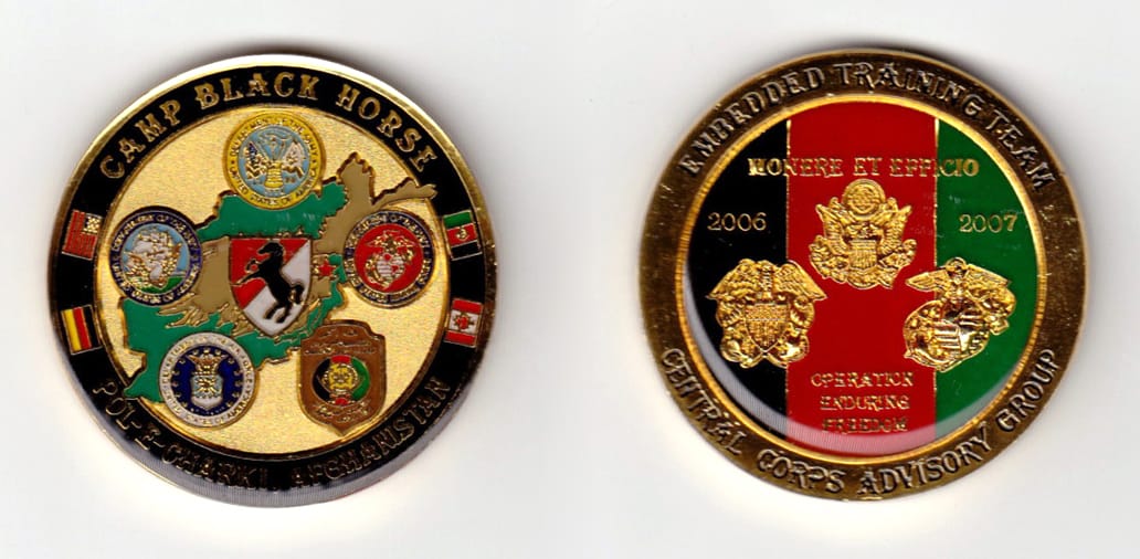 Round shaped, gold colored coin, 2 inches in diameter.