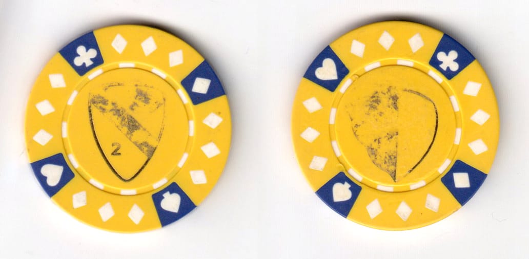 Round shaped, yellow colored poker chip, 1-1/2 inches in diameter.