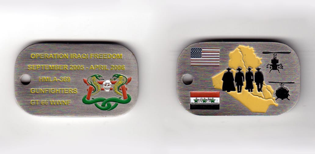 Dog tag shaped, pewter colored coin, 2 inches wide x 1-1/2 inches high.