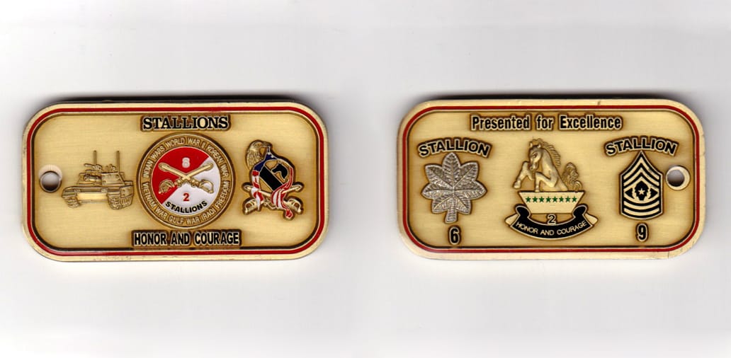 Dog tag shaped, brass colored coin, 2-1/2inches wide x 1-1/4 inches high.