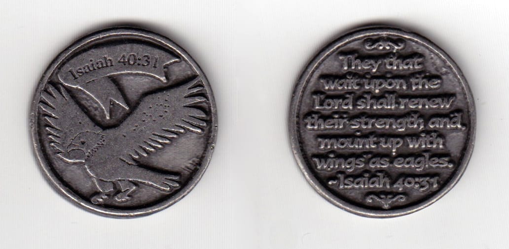 Round shaped, pewter colored coin, 1-1/8 inches in diameter.