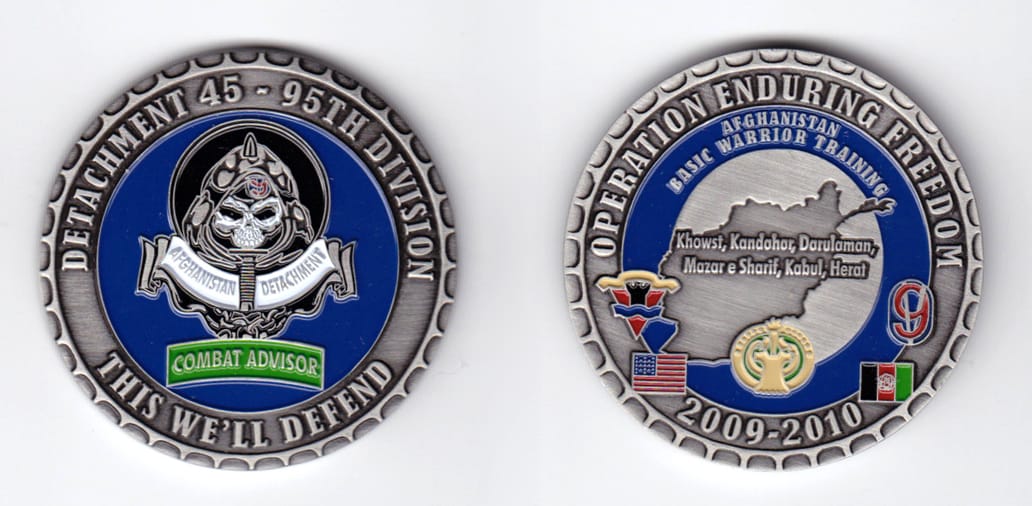 Round shaped, pewter colored coin, 2 inches in diameter.