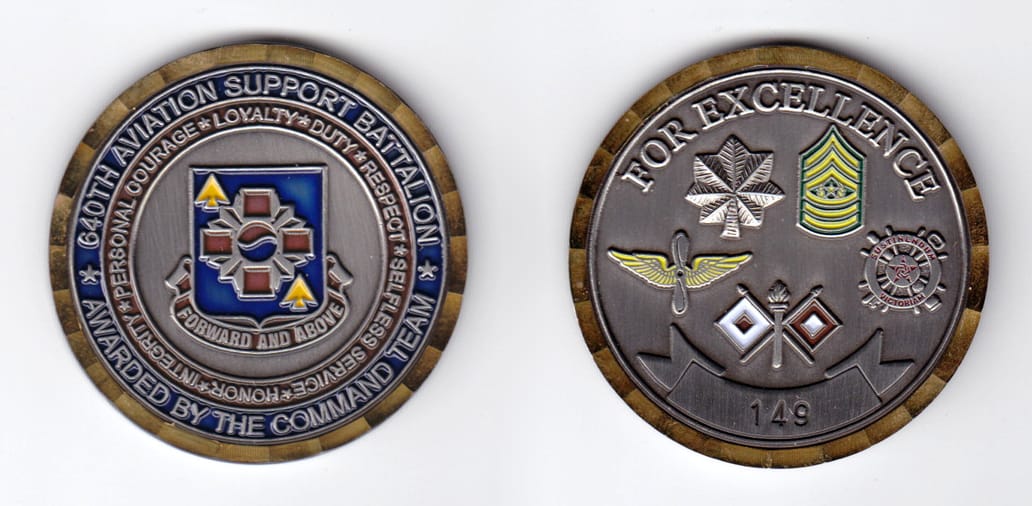 Round shaped, antique brass colored coin, 2 inches in diameter.