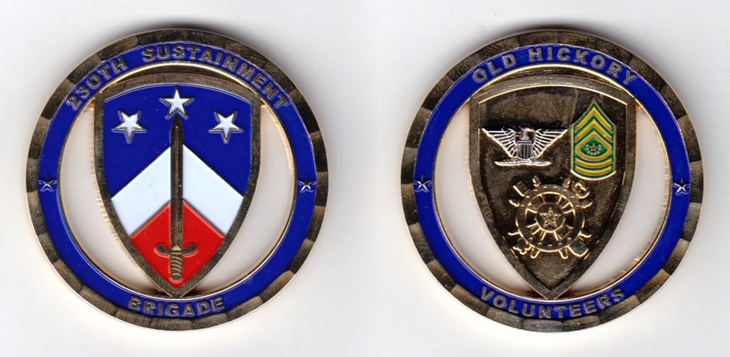 Round shaped, brass colored coin, 2 inches in diameter.