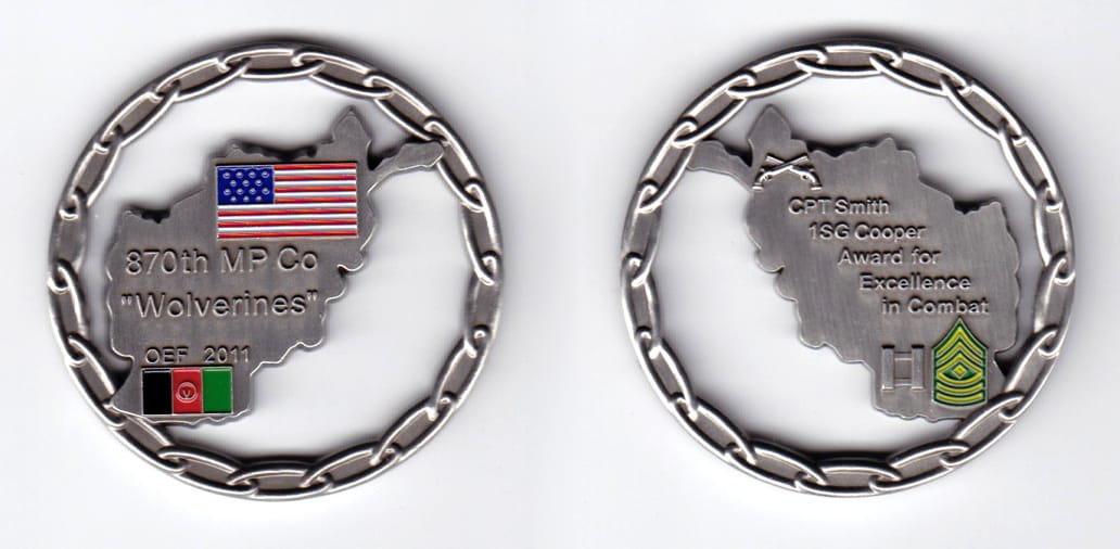 Round shaped, pewter colored coin, 2 inches in diameter.