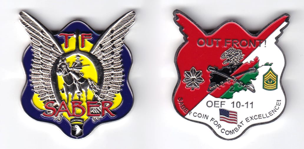 Irregular shaped, with tips of wings extended, silver colored coin,    1-7/8 inches wide x  2 inches high.