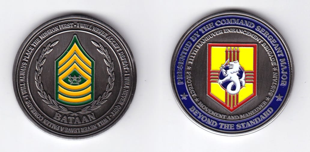 Round shaped, pewter colored coin, 2 inches in diameter.